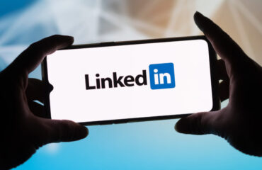 In this photo illustration a LinkedIn logo seen displayed on